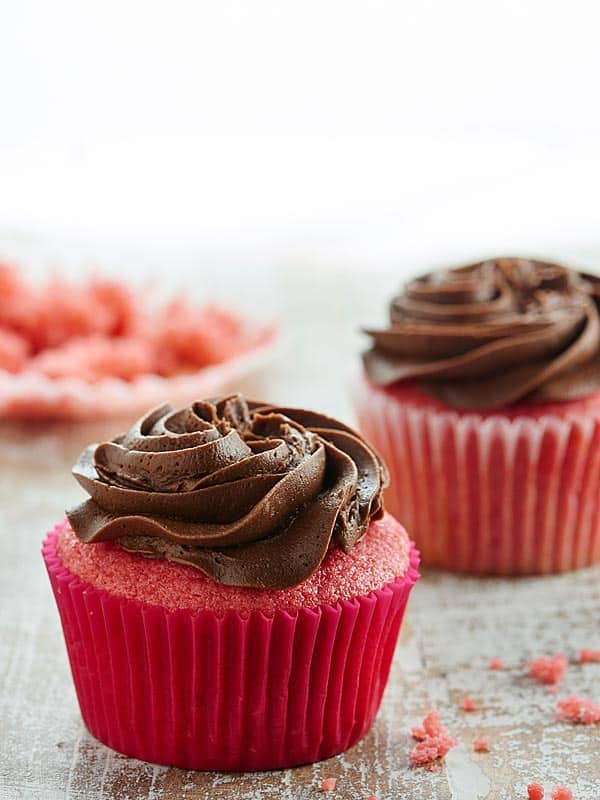 two frosted strawberry cupcakes