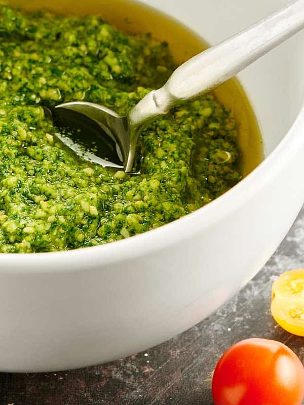 Cilantro pesto in a bowl with spoon