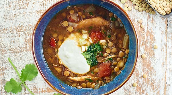 How about a steaming hot bowl of Slow Cooker Chicken Lentil Soup on a chilly day? This soup is easy, healthy, and has less than 350 calories per serving! showmetheyummy.com #slowcooker #chickenlentilsoup