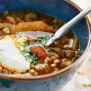 How about a steaming hot bowl of Slow Cooker Chicken Lentil Soup on a chilly day? This soup is easy, healthy, and has less than 350 calories per serving! showmetheyummy.com #slowcooker #chickenlentilsoup