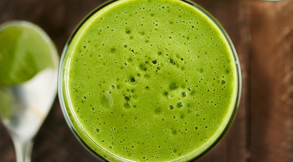 An easy, healthy, tasty tropical green smoothie recipe that's loaded with good for you ingredients like kale, mango, and strawberries! It's gluten free, can be vegan, and only takes 5 minutes to whip up! showmetheyummy.com #greensmoothie #healthy