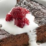 This Vegan Flourless Chocolate Cake Recipe is easy to make, gluten free, & is made w/ better for you ingredients to make a slightly healthier, fudge-y cake! showmetheyummy.com #vegan #flourlesschocolatecake