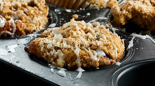These Coffee Cake Muffins are perfectly cinnamon-y, fluffy, tender, moist, are stuffed with a brown sugar, cinnamon filling, & topped with a crunchy streusel! showmetheyummy.com #muffins #coffeecake