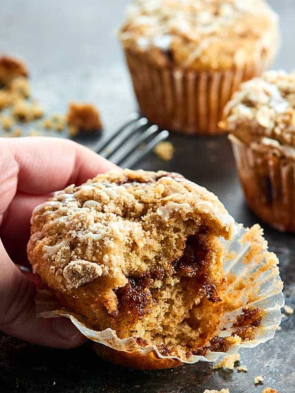 These Coffee Cake Muffins are perfectly cinnamon-y, fluffy, tender, moist, are stuffed with a brown sugar, cinnamon filling, & topped with a crunchy streusel! showmetheyummy.com #muffins #coffeecake