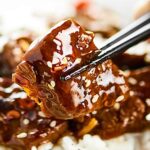After marinating, this Easy Mongolian Beef Recipe takes less than 30 minutes to make! This Mongolian Beef is easy & so flavorful. No frying required! showmetheyummy.com #mongolianbeef #flanksteak