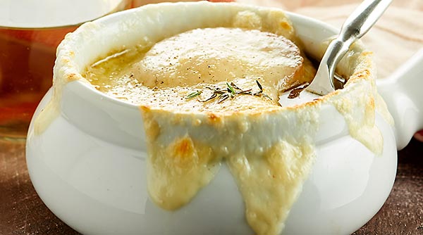 This French Onion Soup Recipe is the perfect appetizer for two! A flavorful beef and onion broth is topped with baguette, parmesan, and gooey swiss cheese! showmetheyummy.com #frenchonionsoup #appetizer