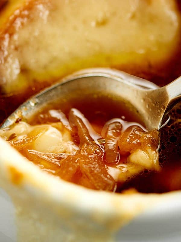 Closeup of french onion soup with spoon