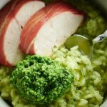This Pesto Risotto with Roasted Chicken and Vegetables is made w/ pan roasted chicken, prosciutto, sweet potatoes, & green beans & cilantro pesto risotto! showmetheyummy.com #risotto #pesto