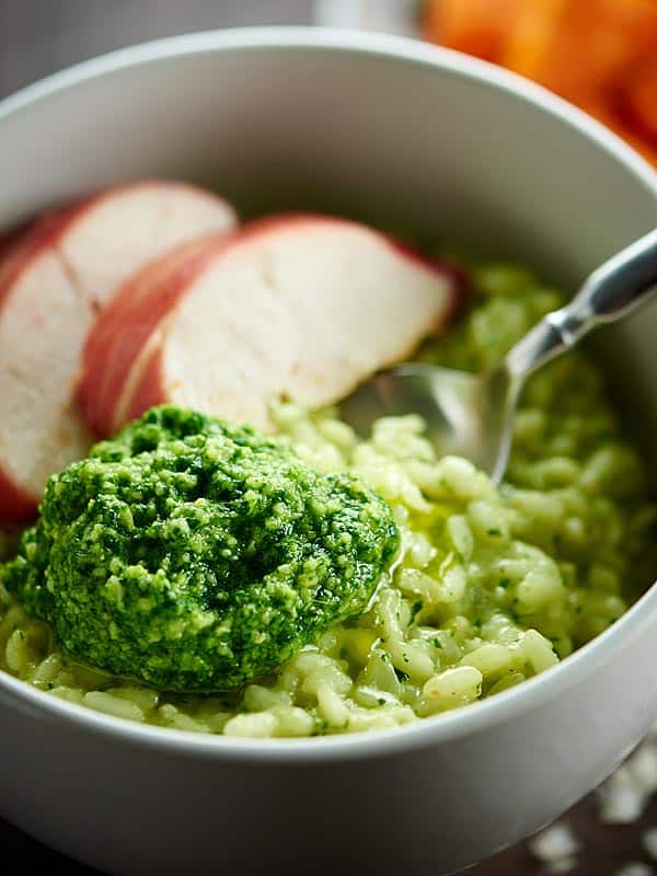 closeup of pesto risotto with chicken