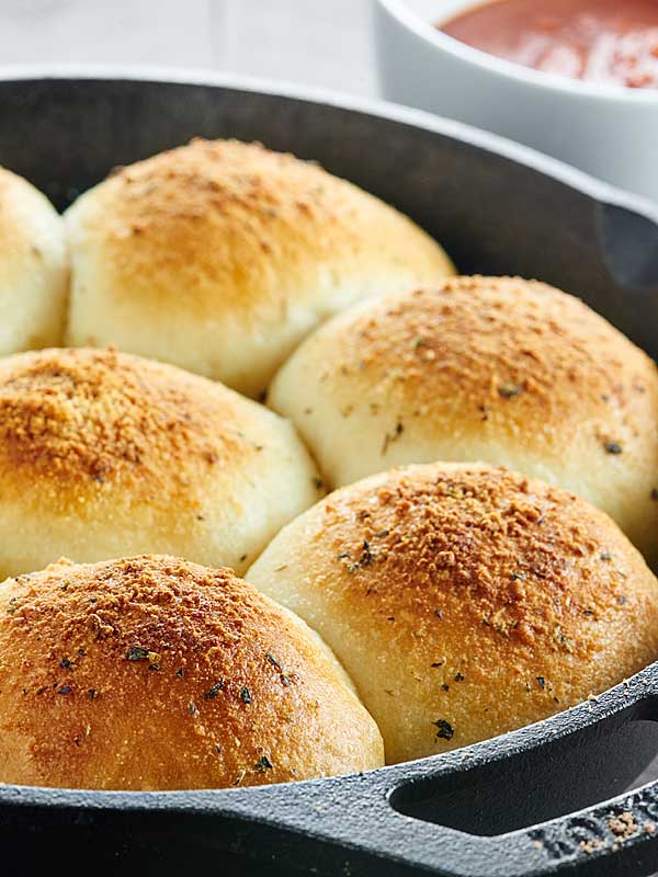 stuffed pizza rolls in skillet closeup