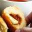 Pre made biscuits are stuffed w/ pizza sauce, cheese, sausage/pepperoni & smothered in butter & pizza spices to make this gooey Stuffed Pizza Rolls Recipe! showmetheyummy.com #pizzarolls #sausagepizza