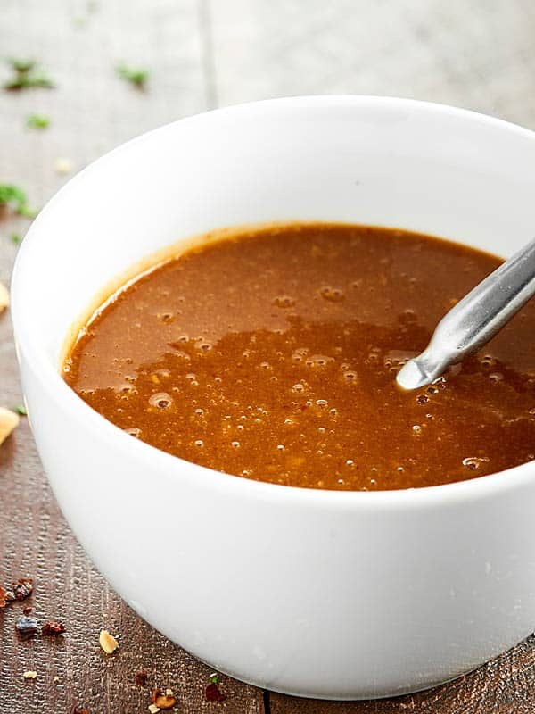 Bowl of thai peanut sauce with spoon