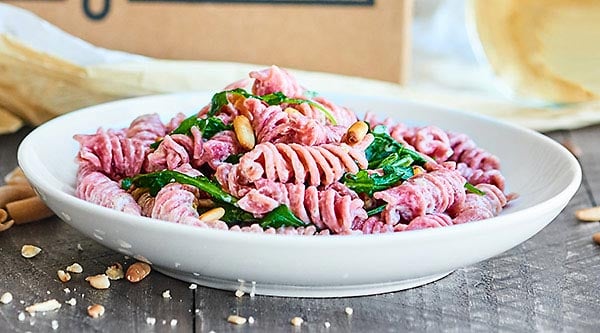 This Beet Pasta Recipe is perfect for spring! Made with fresh beet pasta, lemon juice, a touch of olive oil, arugula, goat cheese, and toasted pine nuts, this pasta is easy, fresh, and delicious! showmetheyummy.com #pasta #vegetarian #pastacrate #ad