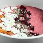 This Cherry Smoothie Bowl Recipe is so easy, healthy, and delicious! Made with only three ingredients: frozen cherries, greek yogurt, and Bai Ipanema Pomegranate, this smoothie bowl is the perfect healthy, gluten free breakfast or snack! showmetheyummy.com #smoothiebowl #cherry