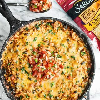 A simple, hearty, yet lightened up meal, this cheesy one pan wonder Mexican Skillet is so easy and full of ground turkey, vegetables, and plenty of cheese! showmetheyummy.com #ad #mexicanfood @sargentocheese