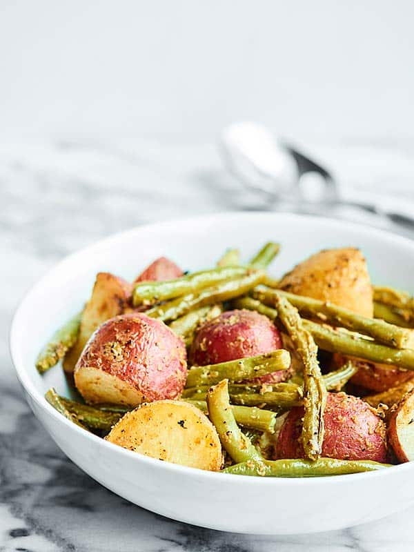 Roasted potatoes and green beans in bowl