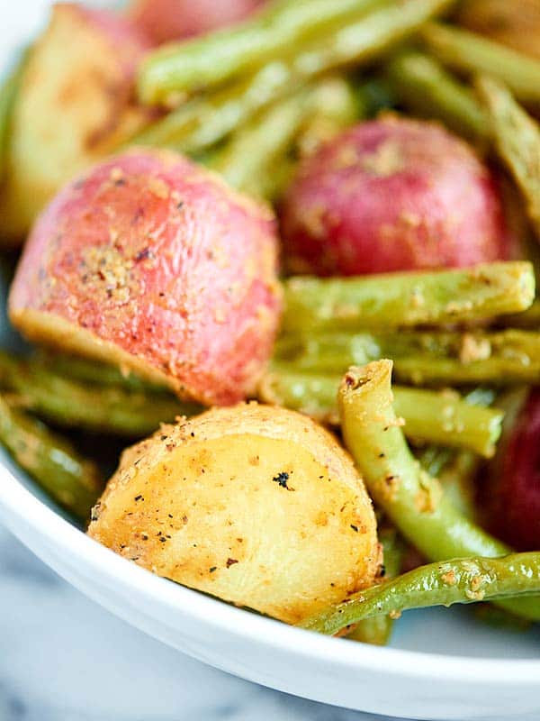 Closeup of roasted potatoes and green beans