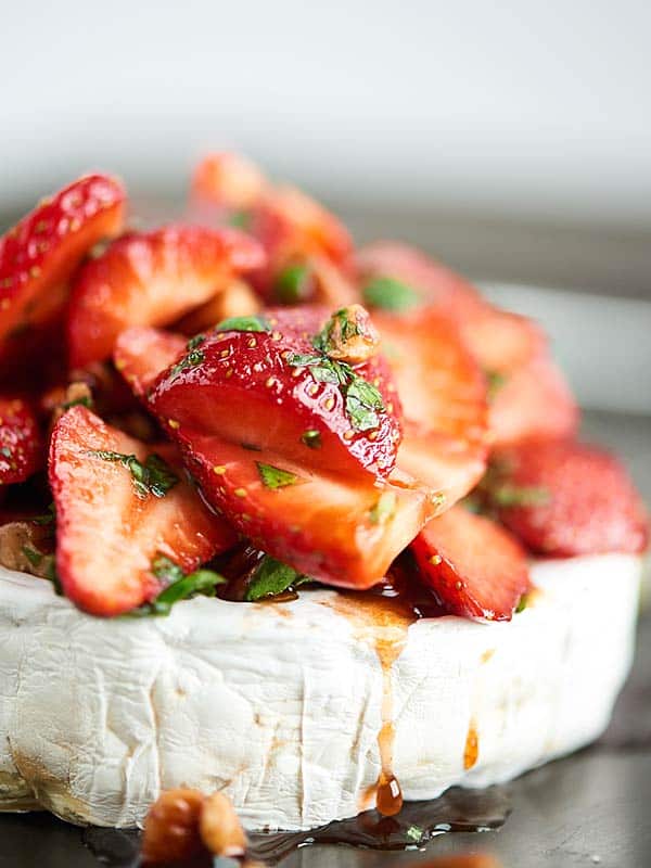 closeup of strawberry baked brie side view