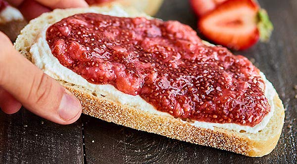 Only 5 ingredients are needed to make this Strawberry Chia Jam. It's vegan, gluten free, easy to make, pretty darn healthy, and helllooo is ultra delicious! showmetheyummy.com #chiajam #strawberryjam