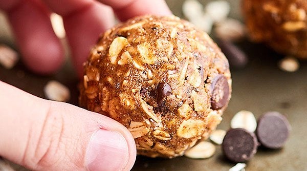 These Almond Butter Energy Bites are SO healthy and delish. They're nutty and rich from the almond butter, chewy from the oats, and sweet from the maple syrup and dark chocolate chips! showmetheyummy.com #almondbutter #energybites