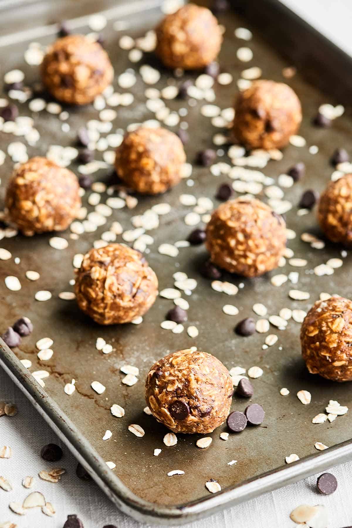 Almond butter energy bites on a baking sheet