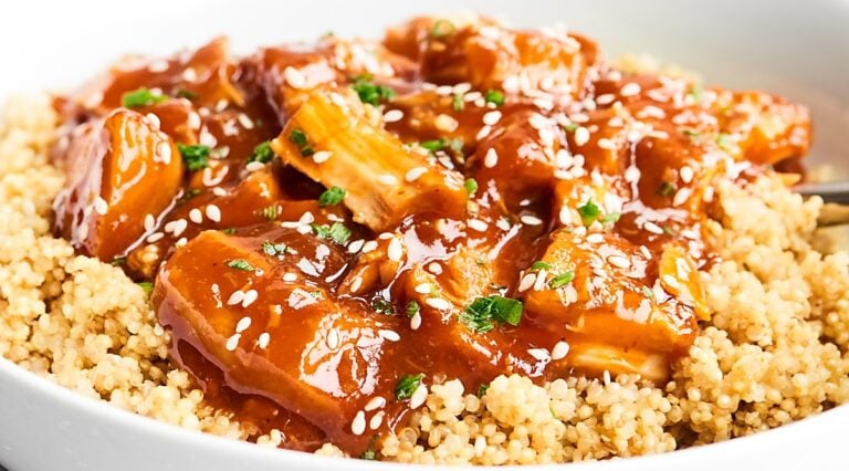 Closeup of bowl of honey sriracha chicken