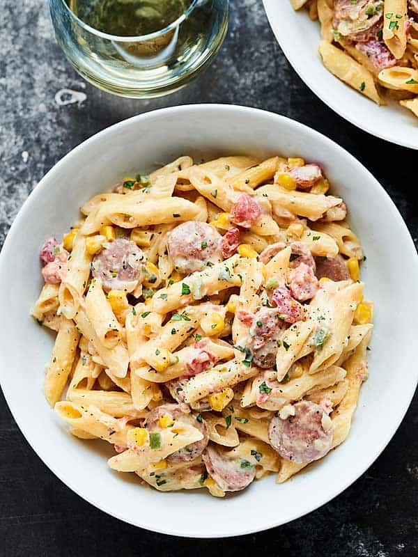 Bowl of spicy chicken sausage pasta above