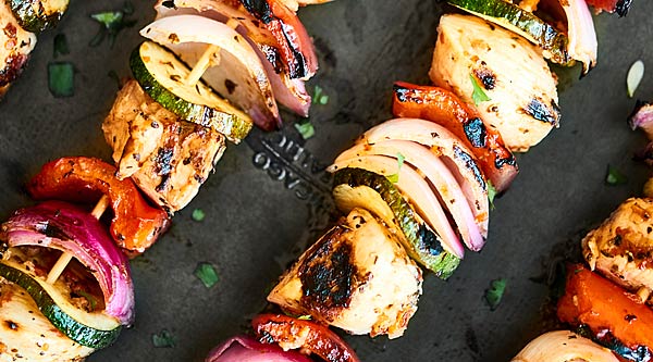 Paired with tzatziki and full of tender chicken, veggies, and an herb-y garlic marinade, these Greek Kebabs are the perfect, quick & easy, healthy summer dinner! showmetheyummy.com #kebabs #greekchicken