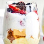 A ridiculously simple dessert, these Lemon Cake Parfaits come together in a matter of minutes and are made with lemon pudding, cool whip, pound cake, and fresh fruit salad! showmetheyummy.com #lemoncake #cakeparfait