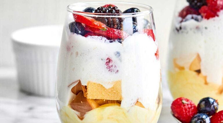 A ridiculously simple dessert, these Lemon Cake Parfaits come together in a matter of minutes and are made with lemon pudding, cool whip, pound cake, and fresh fruit salad! showmetheyummy.com #lemoncake #cakeparfait