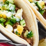 Slow Cooker Carnitas. An easy, flavorful, healthy meal made in the crockpot. Tender pork served in your favorite tortilla and topped with a homemade salsa? Gimme! showmetheyummy.com #porkcarnitas #slowcookercarnitas