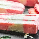 Strawberry Coconut Popsicles, my favorite summer treat! Full of greek yogurt and fresh fruit, the ingredient list is short, the popsicles are creamy dreamy, and you better believe they're healthy enough to enjoy without the guilt! showmetheyummy.com #popsicles #greekyogurt