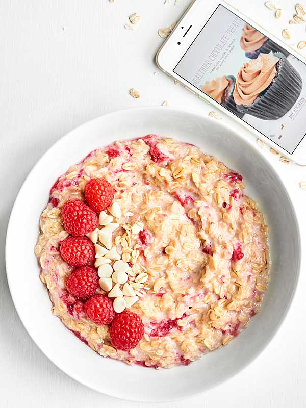bowl of white chocolate berry cheesecake oatmeal above