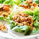 Have a few for a light lunch, or half the recipe for a filling and healthy dinner, these Healthy Asian Lettuce Wraps are full of tender chicken, a crazy flavorful sauce, and loads of texture! showmetheyummy.com #lettucewraps #asianlettucewraps