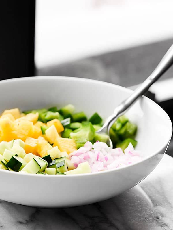 Pineapple salsa ingredients in a bowl