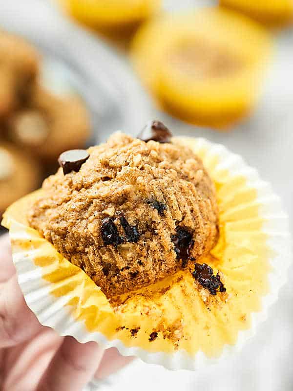 skinny banana chocolate chip muffin partially unwrapped held