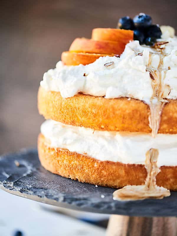 closeup of chardonnay caramel cake on cake stand