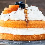 Chardonnay Caramel Cake: a ridiculously easy, flavorful, moist vanilla cake topped with lightly sweetened fluffy whipped cream, and an ultra rich, buttery caramel sauce. Recipe made in partnership w/ @BarefootWine #caramelcake #chardonnay