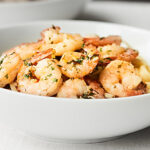 Tender shrimp, butter-y + garlicky sauce... this Easy Shrimp Scampi Recipe is simply perfect! showmetheyummy.com #shrimpscampi #easydinner