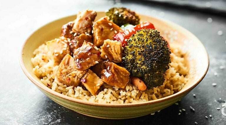 Bowl of teriyaki turkey tenderloin with veggies on brown rice