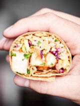 A great use of leftovers, this Teriyaki Turkey Wrap is full of tender turkey, sweet pineapple, crunchy/salty/savory/fresh slaw, earthy brown rice, and a chewy whole wheat tortilla! showmetheyummy.com #turkey #wrap
