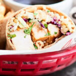 A great use of leftovers, this Teriyaki Turkey Wrap is full of tender turkey, sweet pineapple, crunchy/salty/savory/fresh slaw, earthy brown rice, and a chewy whole wheat tortilla! showmetheyummy.com #turkey #wrap