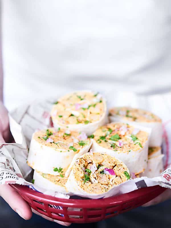 basket of bbq chickpea pinwheels held