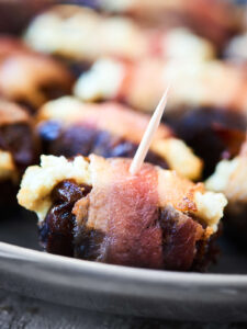 These Bacon Wrapped Dates are perfect for football (or any!) snacking! Only 3 ingredients - bacon, dates, goat cheese - and 20 minutes needed for the easiest and tastiest snack! showmetheyummy.com #baconwrappeddates #goatcheesedates