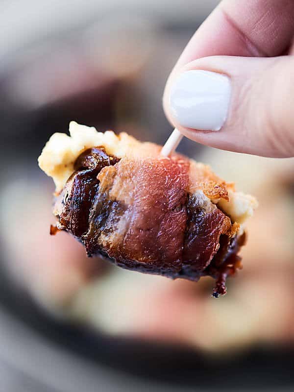 These Bacon Wrapped Dates are perfect for football (or any!) snacking! Only 3 ingredients - bacon, dates, goat cheese - and 20 minutes needed for the easiest and tastiest snack! showmetheyummy.com #baconwrappeddates #goatcheesedates