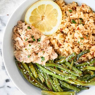 This Lemon Pepper Salmon with Coconut Brown Rice is ready in less than 20 minutes! Tender, lemony salmon is served with Thai inspired brown rice and green beans for a healthy and delicious meal! showmetheyummy.com Made in partnership w/ @chickenofthesea & @minutericeUS #NationalSalmonDay #SalmonLovesRice