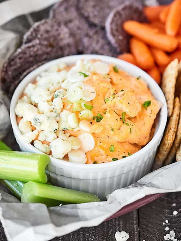 This Slow Cooker Cheesy Buffalo Chicken Dip is the snack dreams are made of! Only 5 minutes of prep for this ultra cheesy, perfectly spicy, super creamy chip dip! showmetheyummy.com #buffalochickendip #slowcookerbuffalochickendip