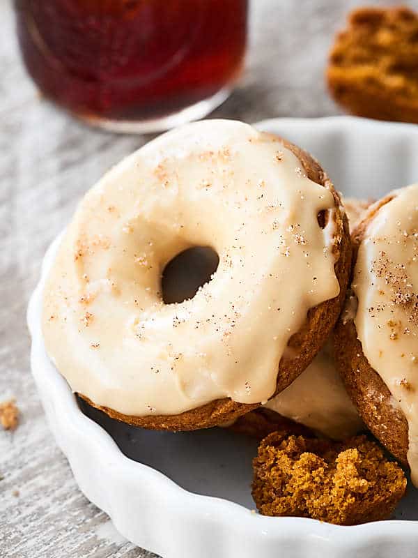 pumpkin donuts with maple glaze on plate