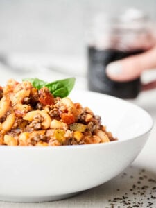 This American Goulash is full of ground beef, vegetables, spices, and macaroni pasta. A one pot wonder on the table in under 30 minutes that's perfect cold weather comfort food! showmetheyummy.com Recipe made in partnership w/ @redgoldtomatoes #HelpCrushHunger #americangoulash