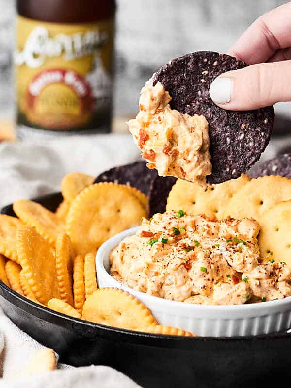 This Crack Dip is highly addictive. You've been warned. ;) Full of cream cheese, bacon, sour cream, spices and more, you're never gonna want to stop eating it! showmetheyummy.com #crackdip #baconappetizer